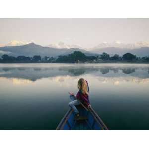 Woman Stares at the Distant Annapurna Range from a Rowboat Stretched 