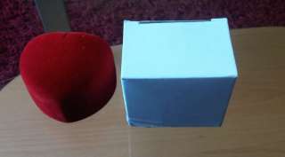 THE MICRO FIBRE HEART SHAPED BOX IS ENCLOSED WITHIN A WHITE BOX.