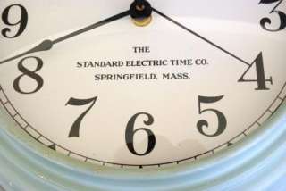 This is a vintage Standard Electric Time Co. wall clock . It is about 
