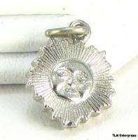 This charm is silver toned. This item is in excellentoriginal and 