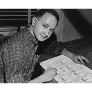  1958 photo Jules Feiffer, seated at work on cartoon 
