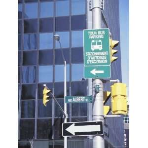  Directional Signs on a City Pole at Intersection 