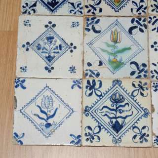Nine Dutch Delft 17th century floral stamp tiles   
