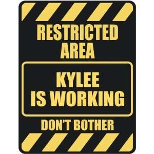   RESTRICTED AREA KYLEE IS WORKING  PARKING SIGN