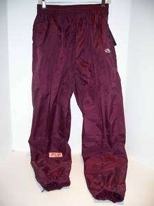 Rawlings PUP Maroon nylon wind pant. Water repellent finish. Unlined w 