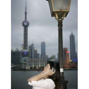 Chinese Woman Listening to Music, the Bund, Shanghai, China, Asia 